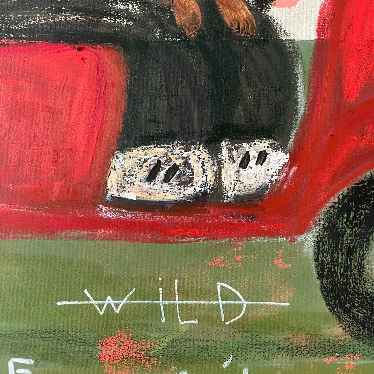 Abstract artwork with red, black, and white elements on a textured surface.