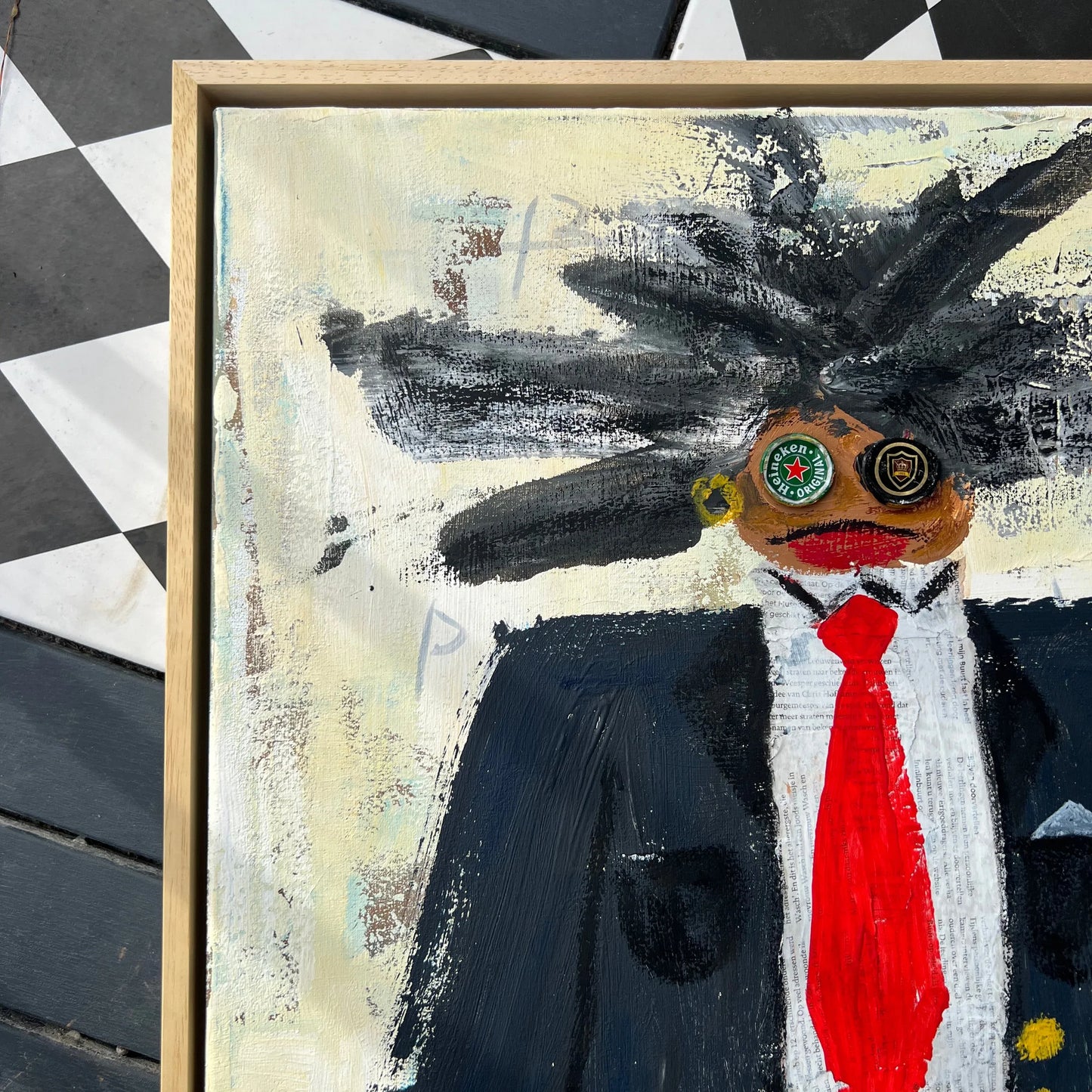 Abstract painting with a large black spider-like creature on a checkered floor.
