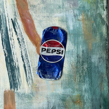 A textured painting featuring a small, stylized blue can of Pepsi in the center, set against an abstract background of teal, green, beige, and brown brushstrokes.