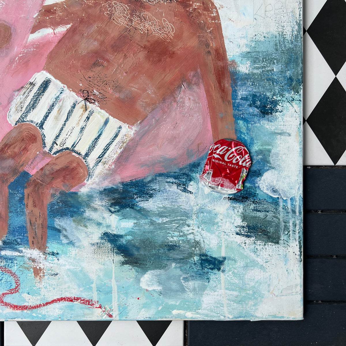 A mixed-media painting of a child in pink swimwear holding a Coca-Cola can, displayed on a black and white checkered surface.