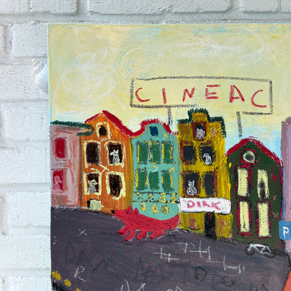 Colorful textured artwork on a white brick wall