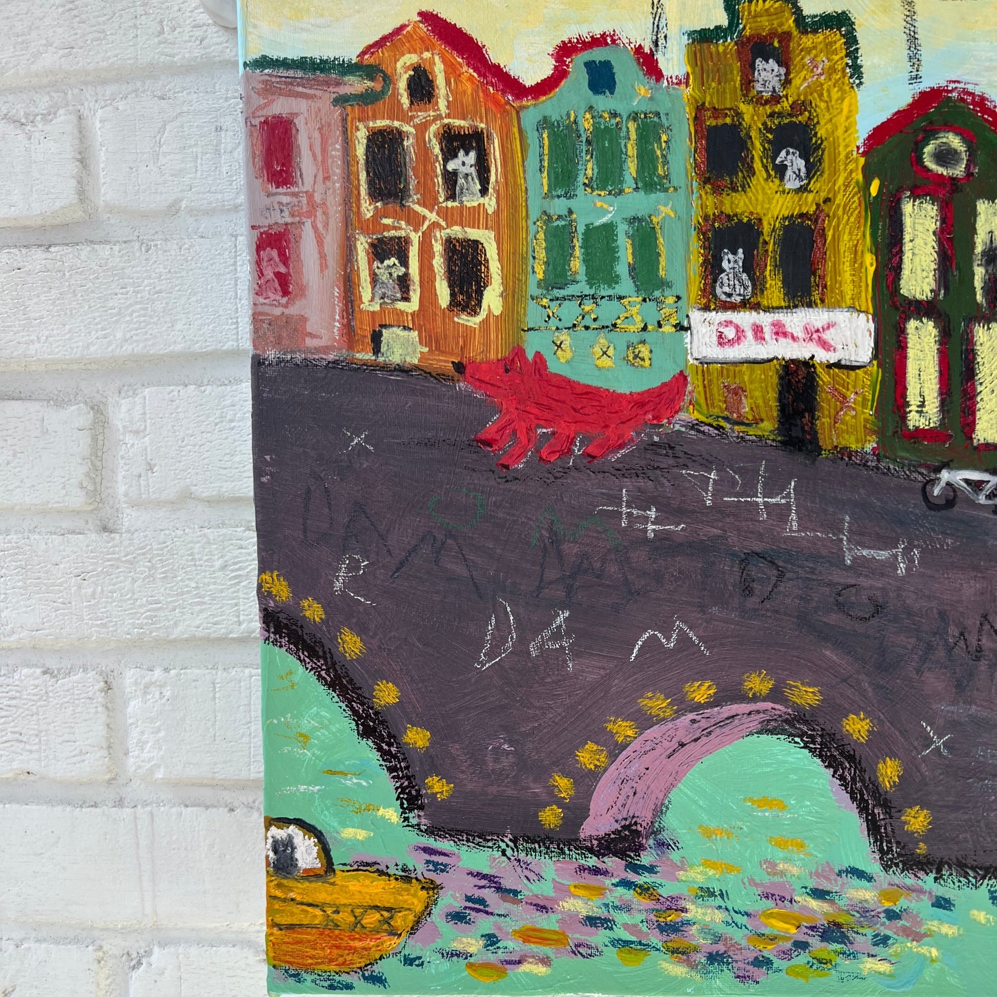 Colorful abstract painting on a textured white wall