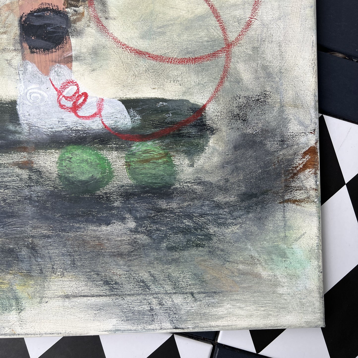 Abstract artwork with a red circle and green shapes on a textured surface.